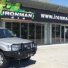 Gray Toyota SUV With Protective Bar In Front of Ironman 4x4 Shop