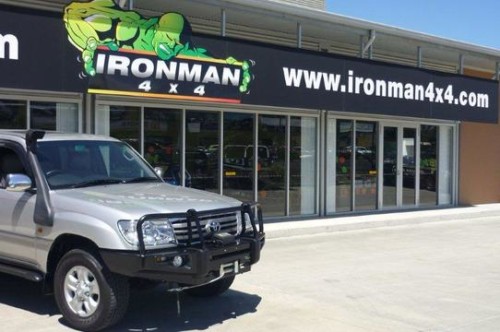 Gray Toyota SUV With Protective Bar In Front of Ironman 4x4 Shop
