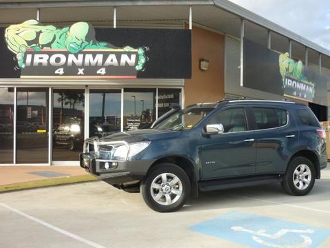 SUV In Front of Ironman 4x4 Shop