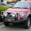 Red Toyota SUV With Protector Bar On The Road
