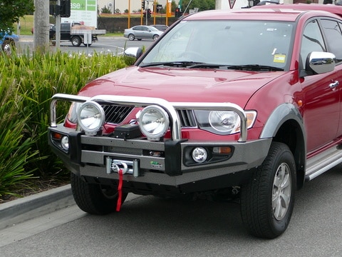 Red Toyota SUV With Protector Bar On The Road